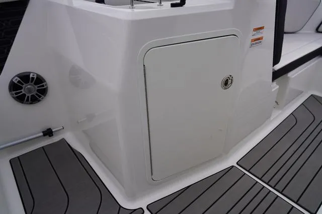 Slide: The Image of 2024 Sea Ray SPX 210 boat interior with storage compartment and speaker. - 37