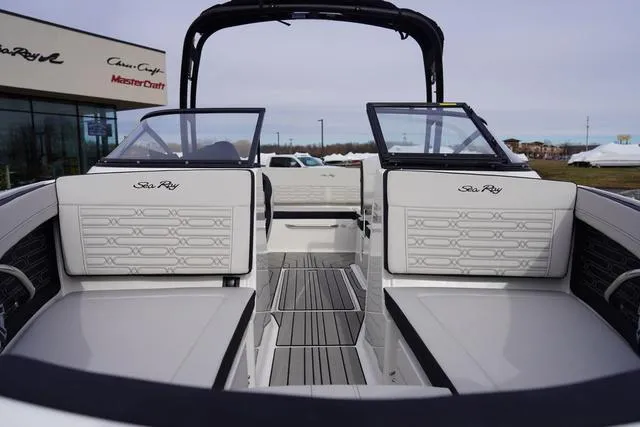 Slide: The Image of 2024 Sea Ray SPX 210 boat interior with sleek seating and modern design. - 4