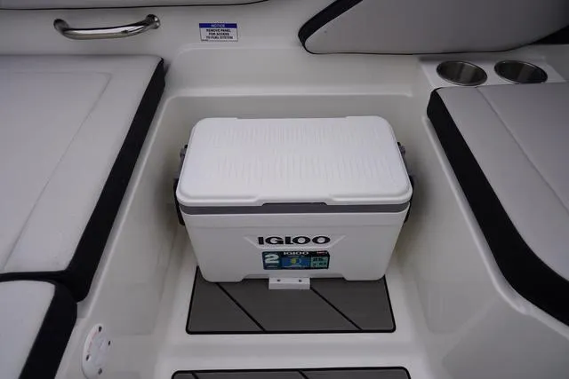 Slide: The Image of 2024 Sea Ray SPX 210 interior with Igloo cooler and seating area. - 45