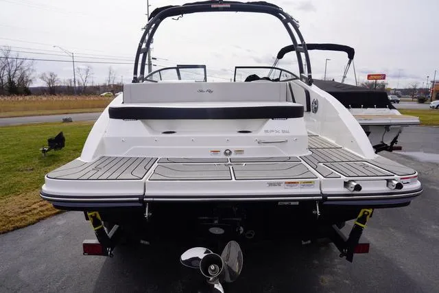 Slide: The Image of 2024 Sea Ray SPX 210 boat, rear view, showcasing swim platform and outboard motor. - 6