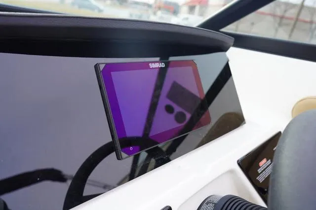 Slide: The Image of 2024 Sea Ray SPX 230 dashboard with Simrad display screen. - 24