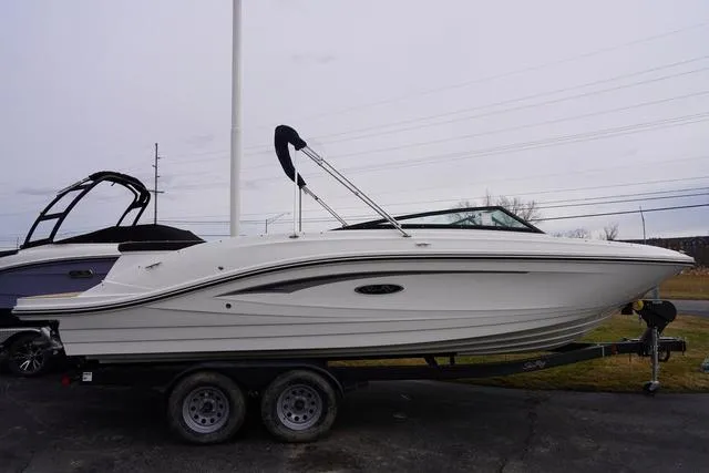 Slide: The Image of 2024 Sea Ray SPX 230 boat on trailer, side view, outdoors. - 3