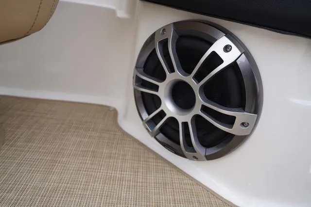 Slide: The Image of 2024 Sea Ray SPX 230 boat speaker on beige carpeted floor. - 37