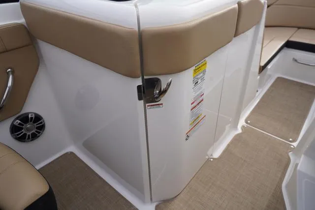 Slide: The Image of 2024 Sea Ray SPX 230 interior with beige seating and sleek design. - 5