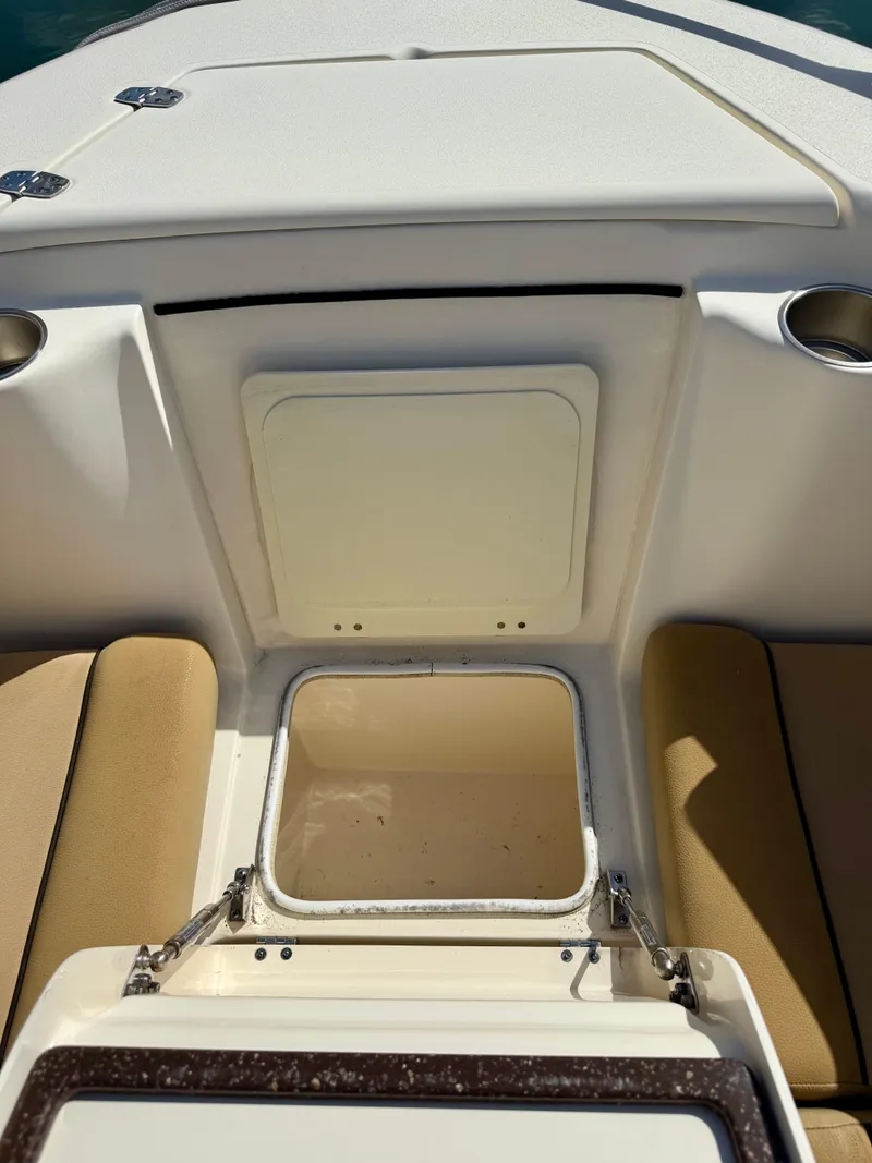 Slide: The Image of 2016 Scout 245 Dorado boat roof detail at marina, clear sky background. - 11