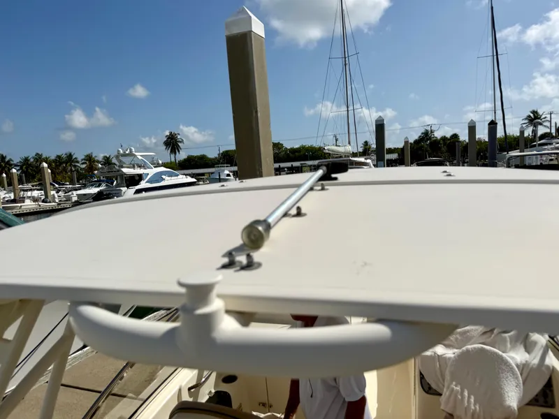 Slide: The Image of Engine compartment of a 2016 Scout 245 Dorado boat showing hoses and components. - 13