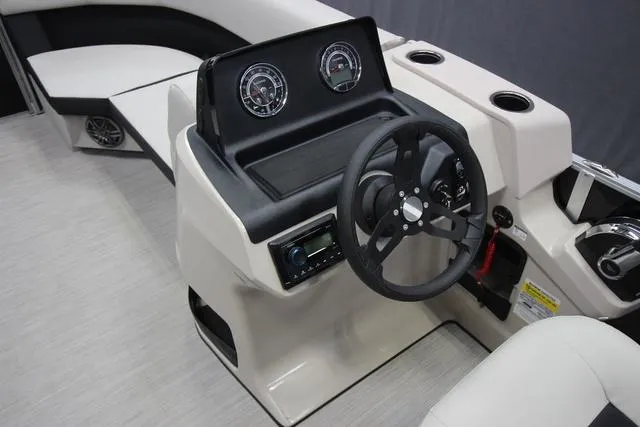 Slide: The Image of 2024 Harris Breeze 210 CW boat dashboard with steering wheel and gauges. - 3