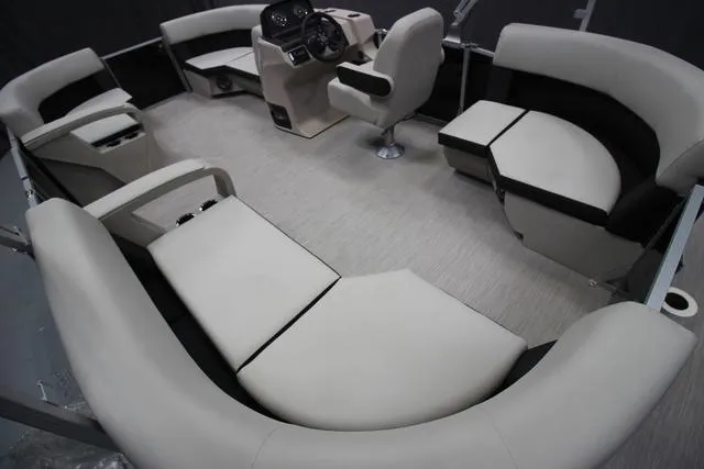 Slide: The Image of 2024 Harris Breeze 210 CW pontoon boat interior with spacious seating and modern helm. - 5