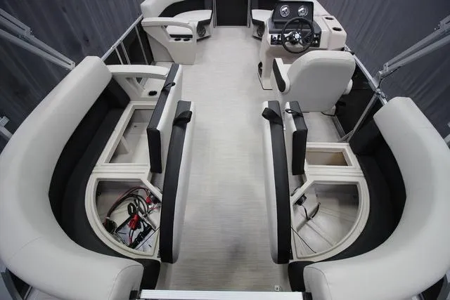 Slide: The Image of 2024 Harris Breeze 210 CW pontoon boat interior with spacious seating and modern helm. - 7