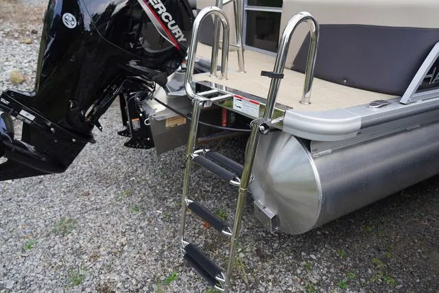 Slide: The Image of 2024 Harris Cruiser 230 CWDH boat with ladder and Mercury outboard motor. - 10