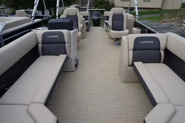 Slide: The Image of 2024 Harris Cruiser 230 CWDH pontoon boat with spacious seating and modern design. - 11