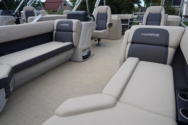 Slide: The Image of 2024 Harris Cruiser 230 CWDH pontoon boat interior with beige and gray seating. - 15