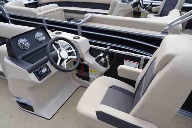 Slide: The Image of 2024 Harris Cruiser 230 CWDH boat interior with steering wheel and seating. - 18