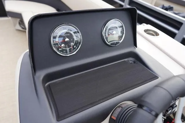 Slide: The Image of Dashboard of 2024 Harris Cruiser 230 CWDH with dual gauges and steering wheel. - 23