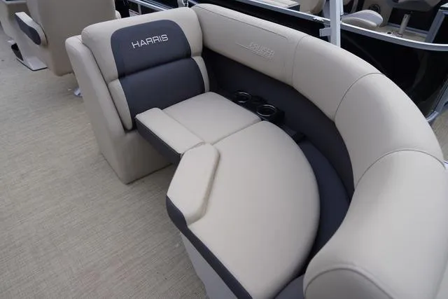 Slide: The Image of 2024 Harris Cruiser 230 CWDH boat seating with beige and gray upholstery. - 29
