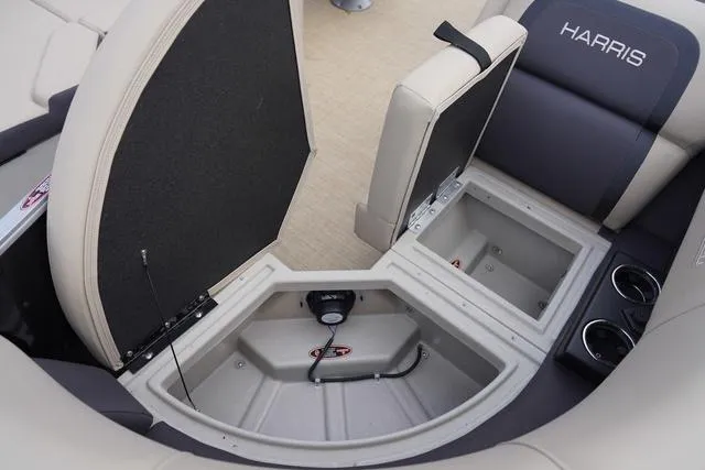 Slide: The Image of 2024 Harris Cruiser 230 CWDH boat interior storage compartments and seating. - 31