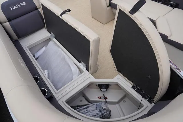 Slide: The Image of 2024 Harris Cruiser 230 CWDH boat interior storage compartments open. - 39