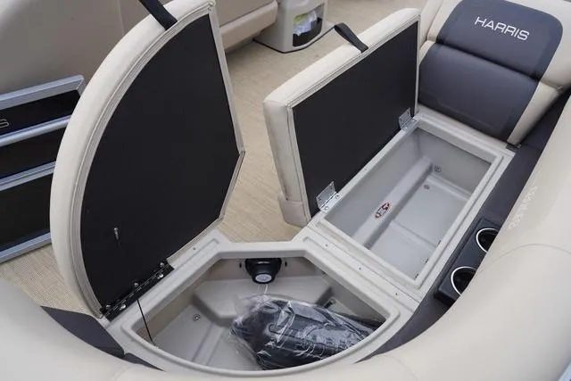 Slide: The Image of 2024 Harris Cruiser 230 CWDH boat interior storage compartments open, showcasing spacious design. - 40