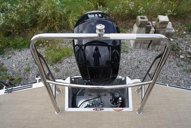 Slide: The Image of 2024 Harris Cruiser 230 CWDH boat engine view with stainless steel railing. - 9