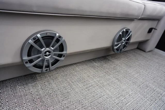 Slide: The Image of Barletta Boats A22UC 2025 model with JBL speakers on beige interior. - 10