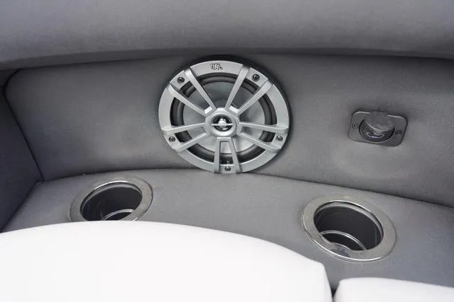 Slide: The Image of 2025 Barletta Boats A22UC interior with speaker and cup holders. - 11