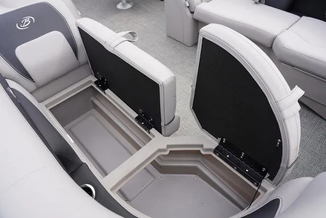 Slide: The Image of 2025 Barletta Boats A22UC interior storage compartment with open seats, showcasing spacious design. - 12