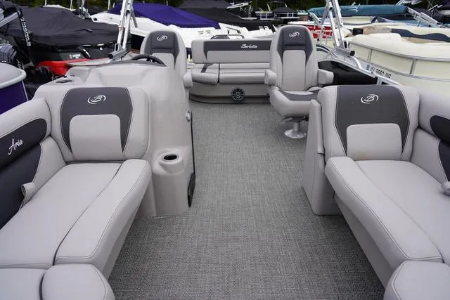Slide: The Image of 2025 Barletta Boats A22UC interior with gray seating and modern design. - 16