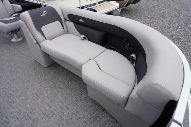 Slide: The Image of 2025 Barletta Boats A22UC luxury seating with gray upholstery and integrated speaker system. - 18