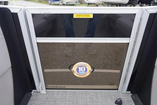 Slide: The Image of 2025 Barletta Boats A22UC interior gate with 10-year warranty sticker. - 19