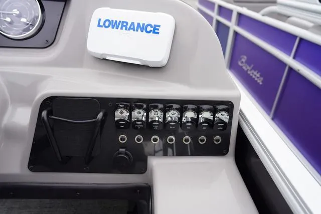 Slide: The Image of Control panel of 2025 Barletta A22UC boat with Lowrance device and switches. - 25
