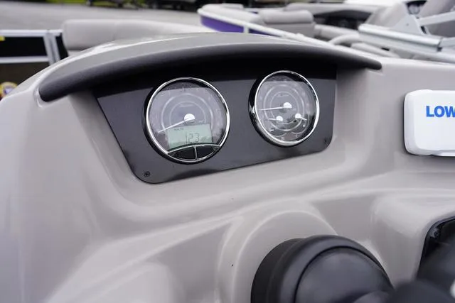 Slide: The Image of Dashboard of 2025 Barletta Boats A22UC with dual gauges and controls. - 26