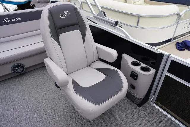 Slide: The Image of 2025 Barletta A22UC boat seat with armrests and cup holders. - 33