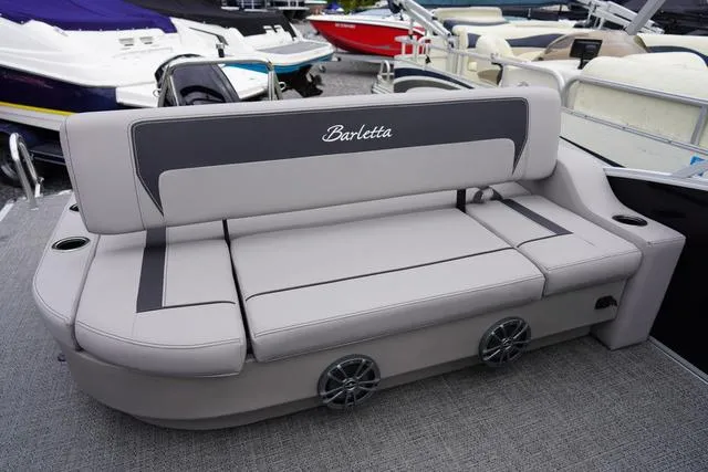 Slide: The Image of 2025 Barletta A22UC boat seating with integrated speakers and cup holders. - 35