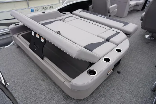 Slide: The Image of 2025 Barletta Boats A22UC interior with convertible seating and cup holders. - 37