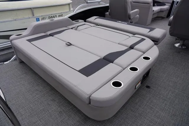 Slide: The Image of 2025 Barletta Boats A22UC interior with gray cushioned seating and cup holders. - 40