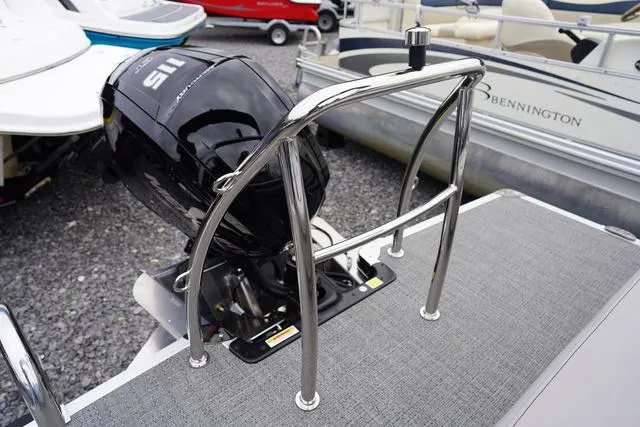 Slide: The Image of 2025 Barletta Boats A22UC with sleek outboard motor and stainless steel railing. - 42