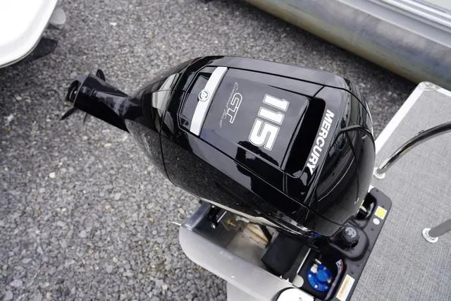 Slide: The Image of Mercury 115 outboard motor on 2025 Barletta Boats A22UC, displayed on gravel surface. - 43