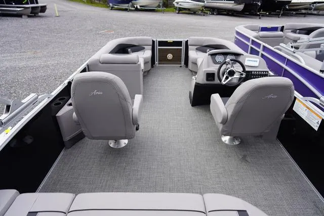 Slide: The Image of 2025 Barletta Boats A22UC interior with gray seating and modern dashboard. - 7