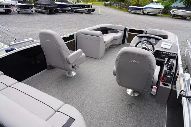 Slide: The Image of 2025 Barletta Boats A22UC interior with gray seating and modern dashboard. - 8