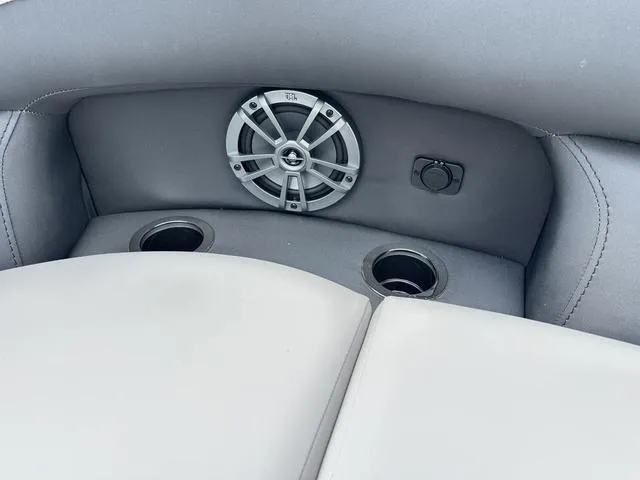 Slide: The Image of 2025 Barletta Boats A22UC interior with speaker and cup holders. - 10