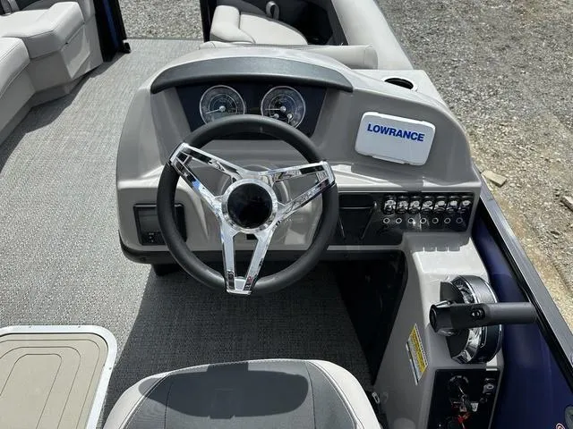 Slide: The Image of Steering console of 2025 Barletta Boats A22UC with Lowrance system and modern controls. - 17