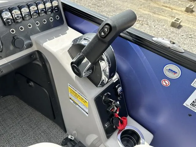 Slide: The Image of Control panel of 2025 Barletta Boats A22UC with throttle and switches. - 21