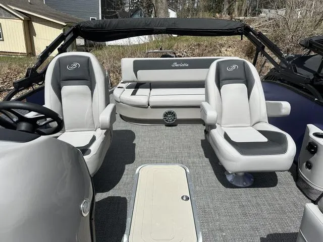 Slide: The Image of 2025 Barletta A22UC boat interior with plush seating and modern design. - 26