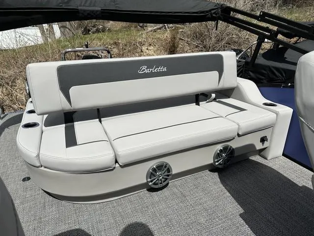 Slide: The Image of 2025 Barletta A22UC boat with sleek gray seating and integrated speakers. - 27