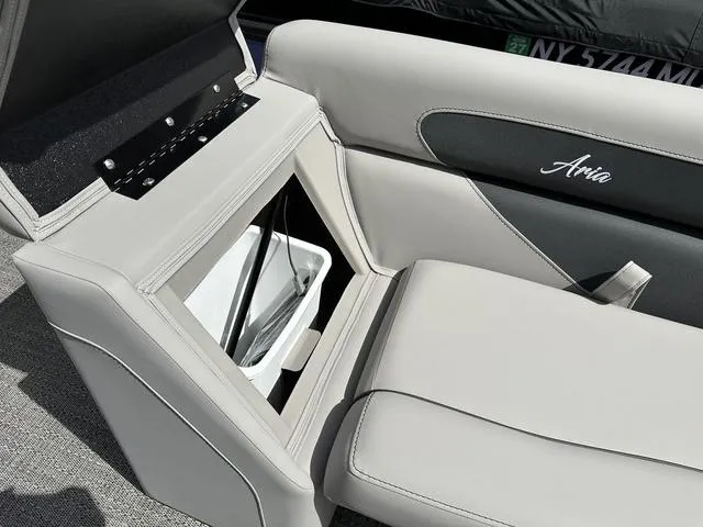 Slide: The Image of 2025 Barletta A22UC boat seat with storage compartment open, showcasing sleek design. - 31