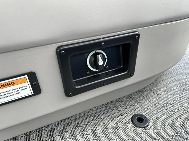 Slide: The Image of Control panel on 2025 Barletta Boats A22UC, featuring a warning label. - 33