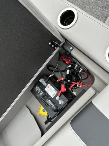 Slide: The Image of Battery compartment of 2025 Barletta Boats A22UC with wiring and cup holders. - 41