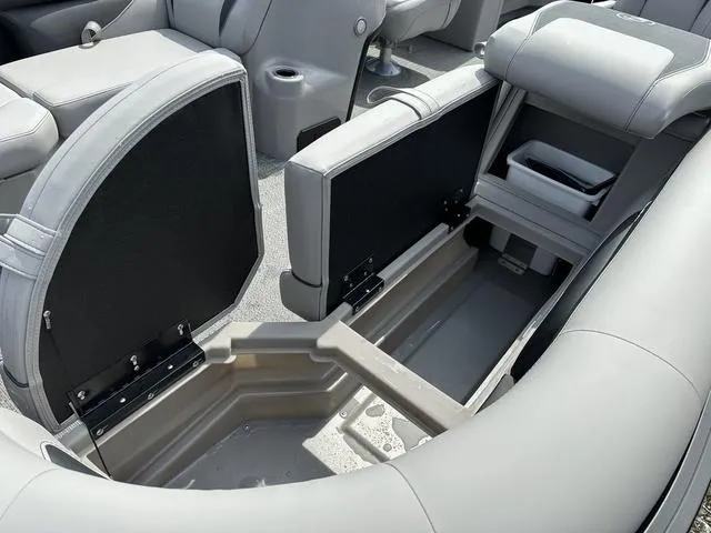 Slide: The Image of 2025 Barletta Boats A22QC interior storage compartment with open seats, showcasing spacious design. - 13
