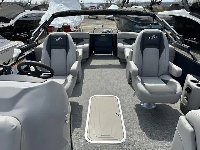 Slide: The Image of 2025 Barletta Boats A22QC interior with gray seating and steering wheel. - 25