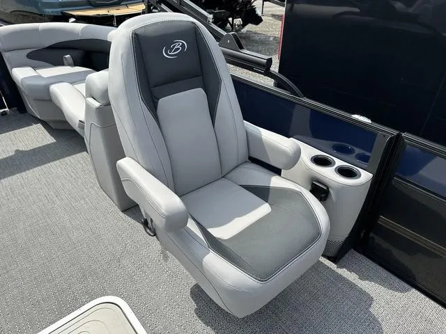 Slide: The Image of Luxurious seating on 2025 Barletta Boats A22QC with cup holders and sleek design. - 26